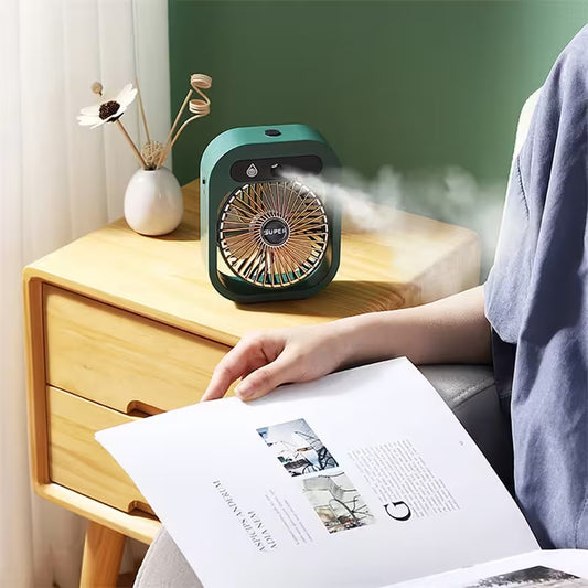 Small humidifier on a wooden nightstand with steam coming out, person reading a book nearby.