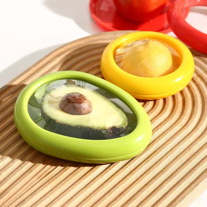 Two avocado containers, one green and one yellow, on a wooden surface.