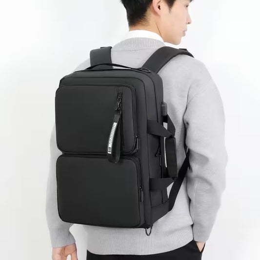 Person wearing a black backpack on a white background