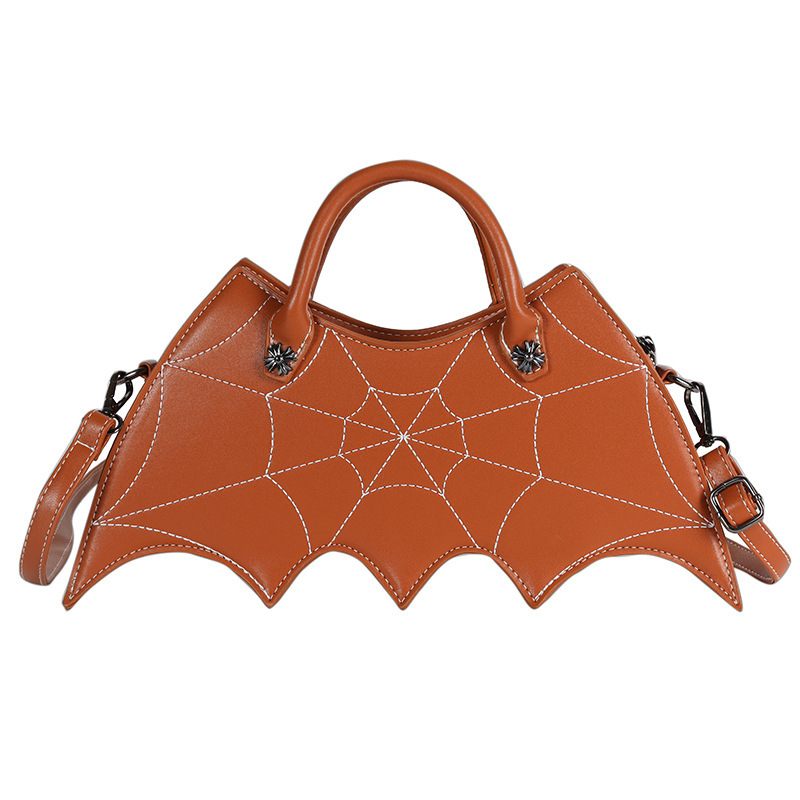 Brown bat-shaped handbag with spider web design on a white background