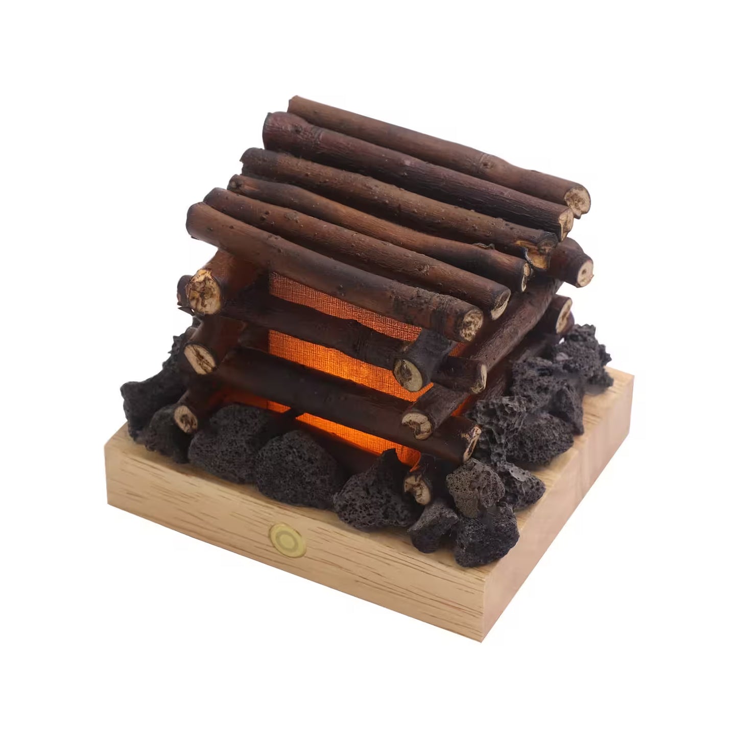 Wooden log cabin toy with lava rocks on a white background