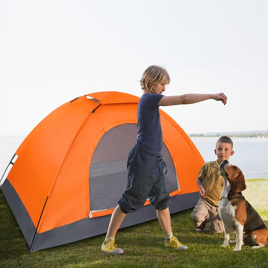Two children and a dog standing near an orange tent outdoors.