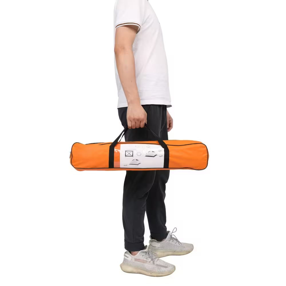 Person holding an orange and black bag with a white label on a white background