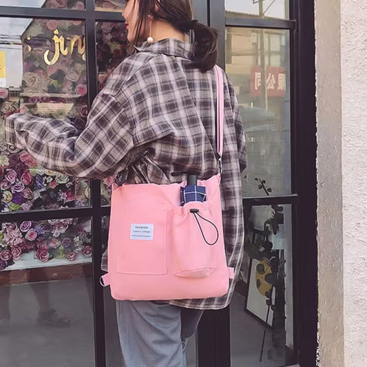 Person wearing a pink backpack in front of a store window