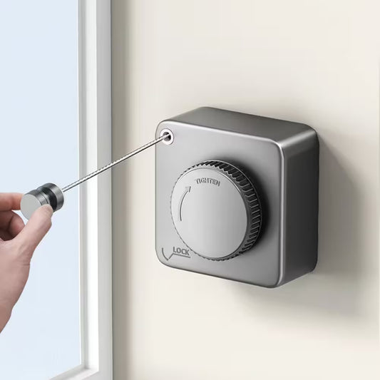 Hand using a screwdriver to adjust a silver lock mechanism on a wall.