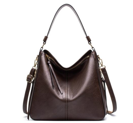 Brown leather handbag with gold hardware on a white background
