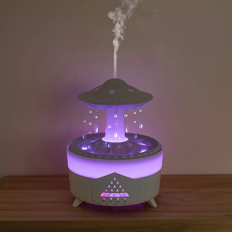 UFO-shaped humidifier emitting mist on a wooden surface with a plain background