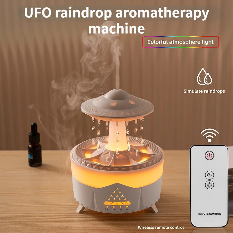 UFO raindrop aromatherapy machine with remote control on a wooden surface
