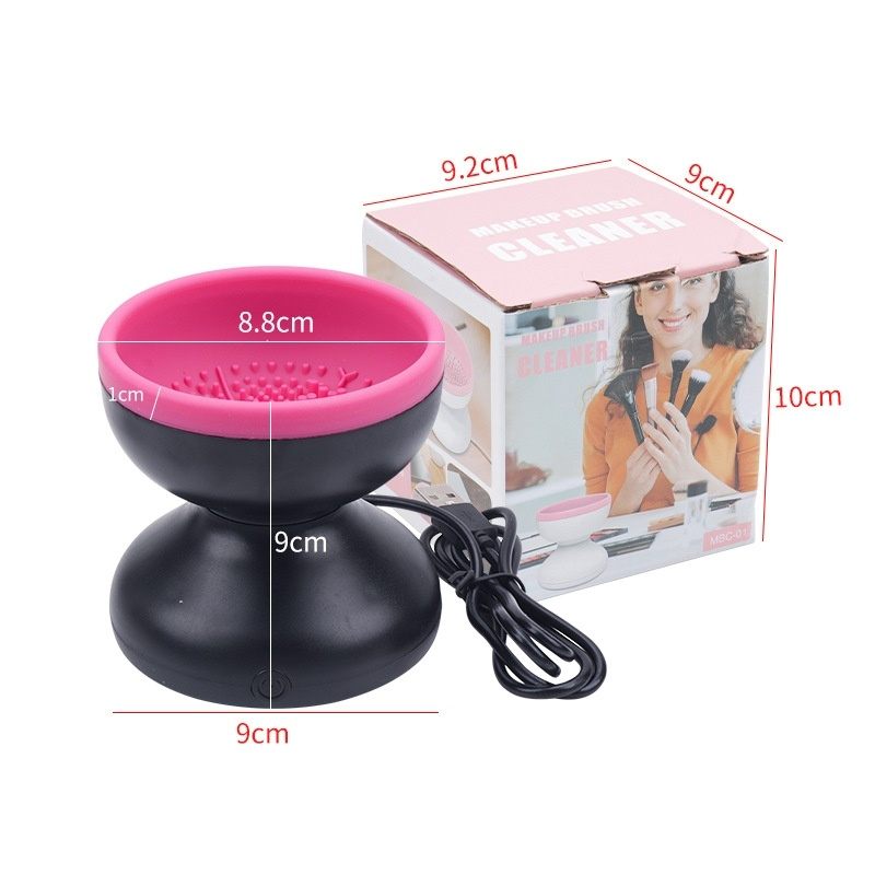 Black and pink device with measurements and a box in the background