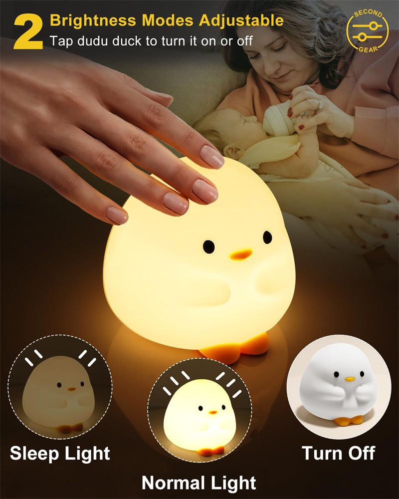 Children's night light shaped like a duck with brightness mode options and a hand interacting with it.
