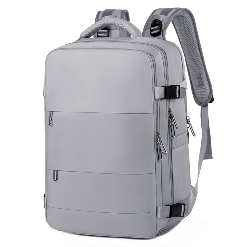 Gray backpack with multiple zippers on a white background