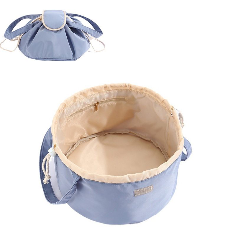 Blue fabric bag with beige interior on a white background