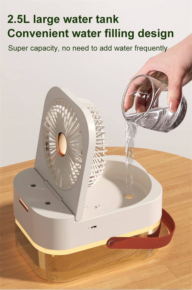 Hand filling a 2.5L water tank into a portable fan on a wooden surface.