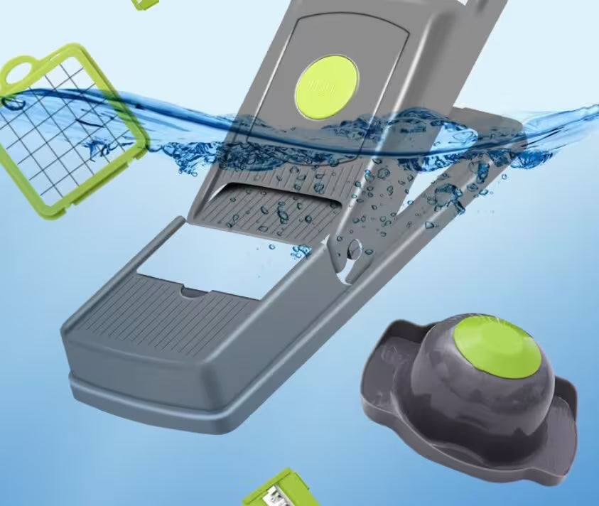 Gray and green kitchen tool with water splashes on a blue background