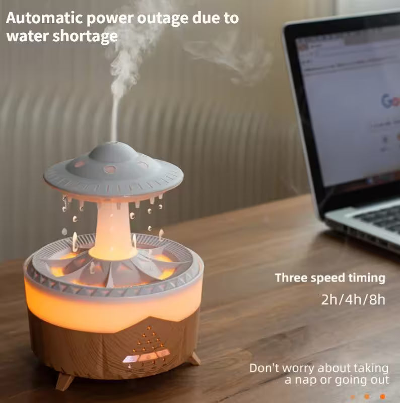 UFO-shaped humidifier on a desk with a laptop in the background