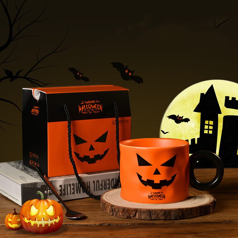 Halloween-themed mug, bag, and decorations on a wooden surface with a dark background.