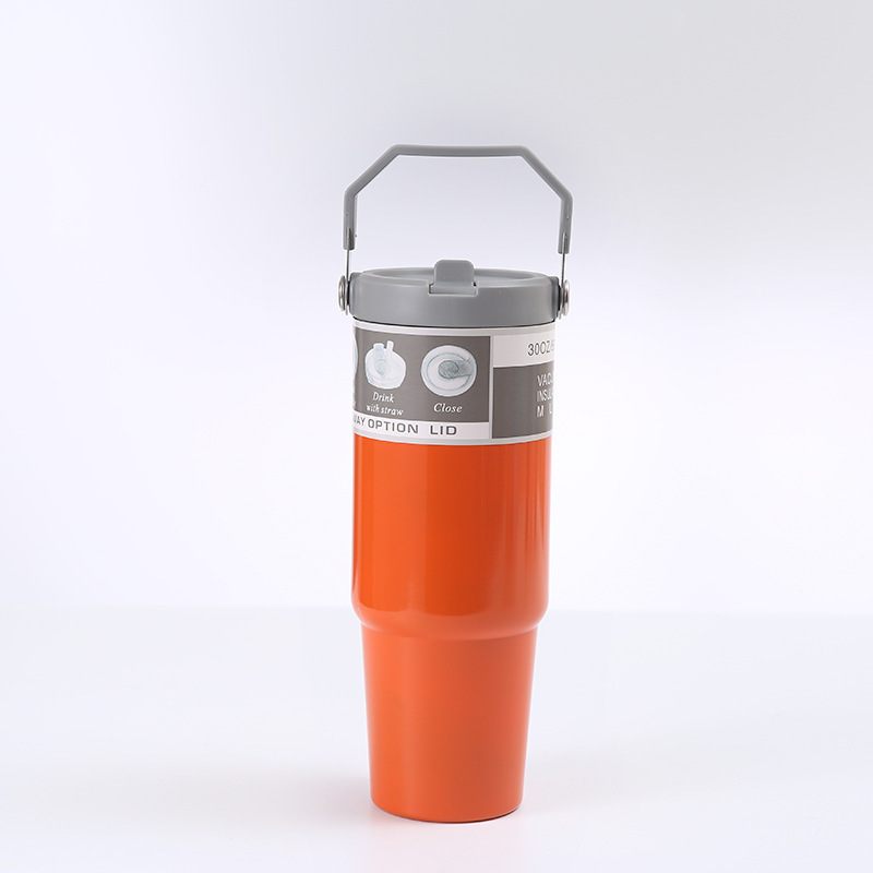 Orange insulated mug with gray lid on a white background