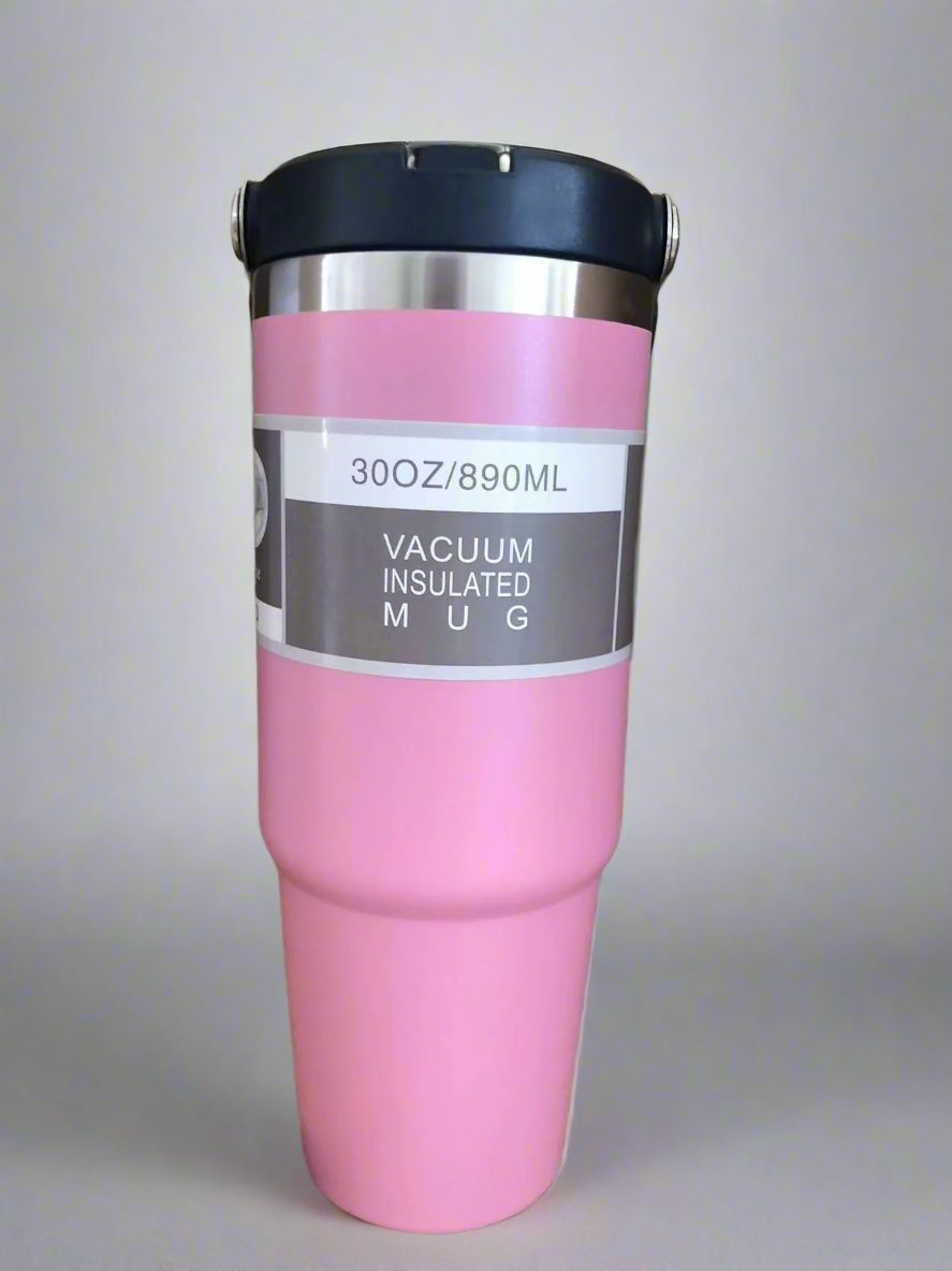 Pink vacuum insulated mug with a black lid on a light gray background