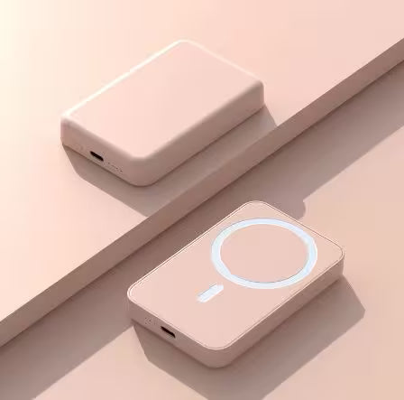 Two pink electronic devices on a light pink background