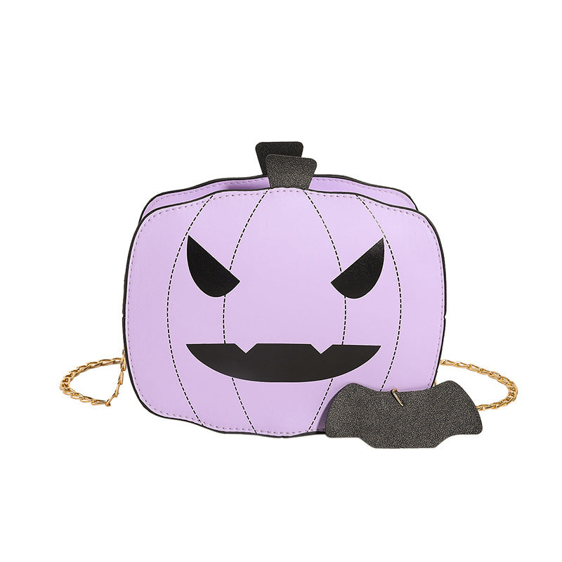 Purple pumpkin-shaped bag with a black face on a white background