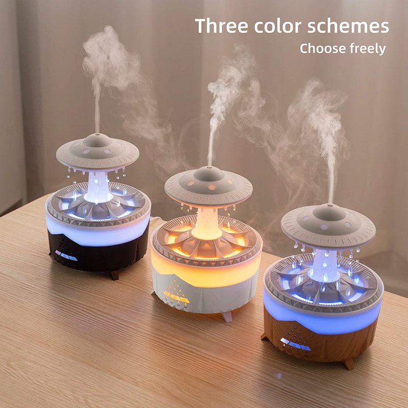Three colorful diffusers emitting mist on a wooden surface with text 'Three color schemes Choose freely'.