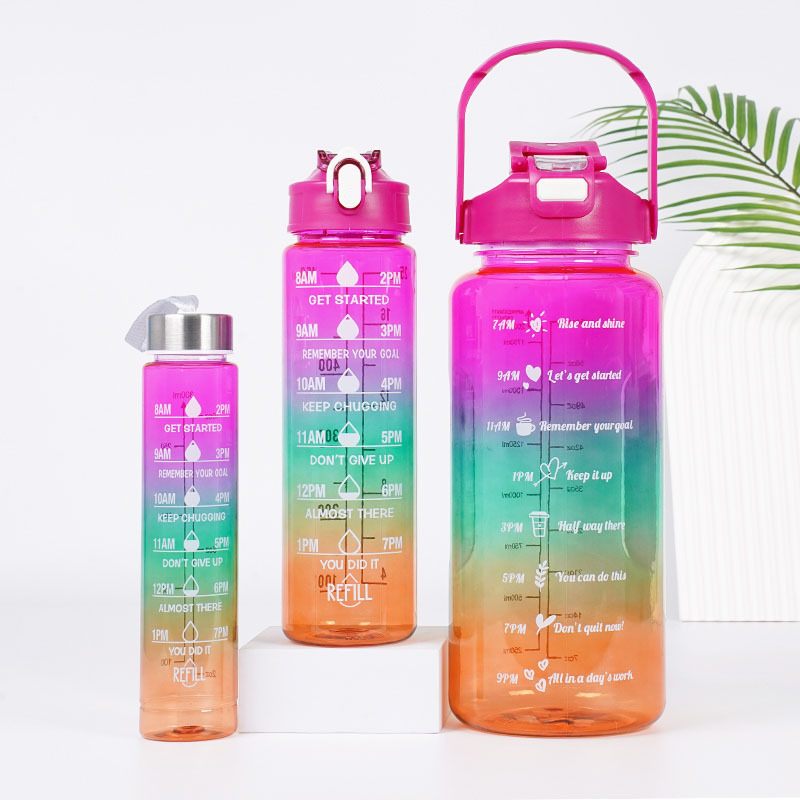 Set of colorful water bottles with motivational text on a white background