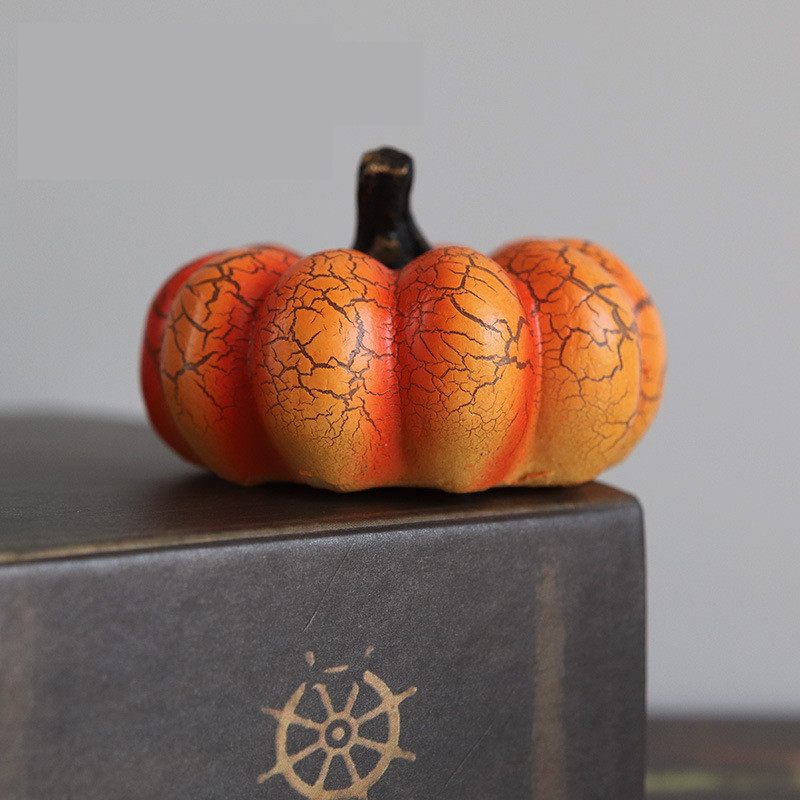 Pumpkin with cracked texture on a gray surface
