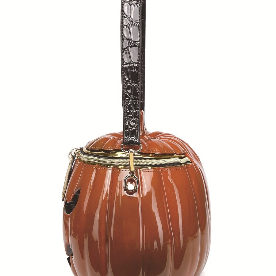 Pumpkin-shaped handbag with decorative handle on a white background
