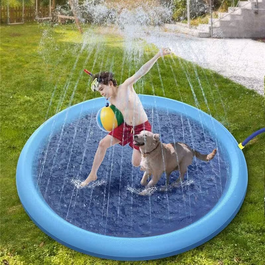 Child playing with a dog on a blue inflatable sprinkler pad in a grassy area.