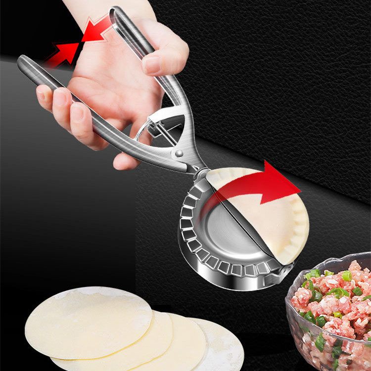Dough press being used to make dumplings with a black background