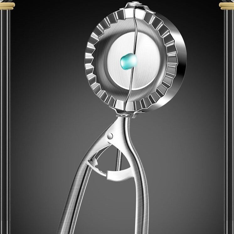 Metallic fruit peeler on a dark background