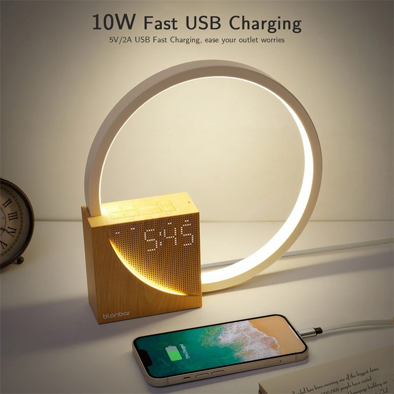 Smart clock with circular light display and smartphone on a table, featuring 10W fast USB charging.