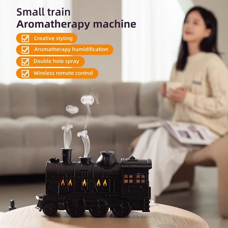 Small train aromatherapy machine with features listed, placed on a surface with a blurred person in the background.