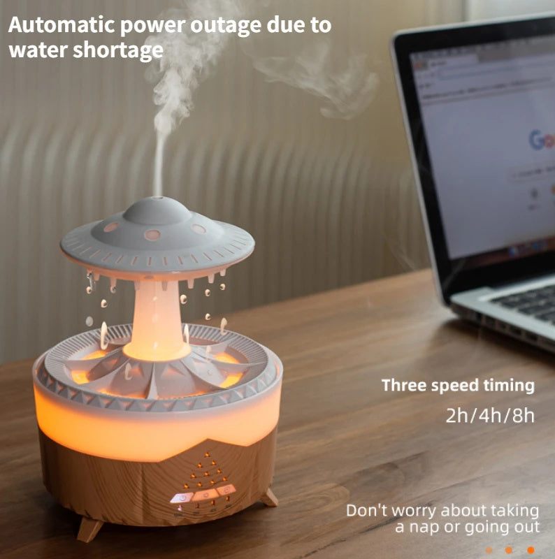 UFO-shaped humidifier on a desk with a laptop in the background