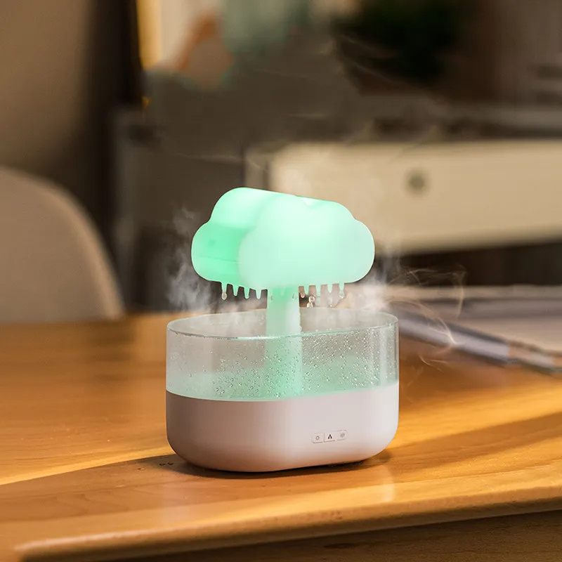 Humidifier with cloud-shaped top on a wooden surface