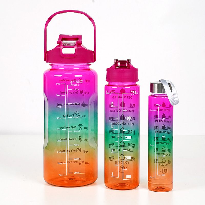 Gradient pink to orange water bottles with measurement markings on a white background