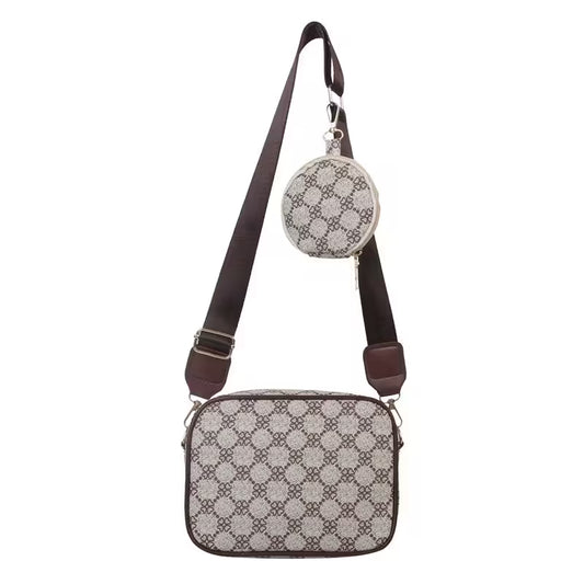 Patterned crossbody bag with matching round pouch on a white background