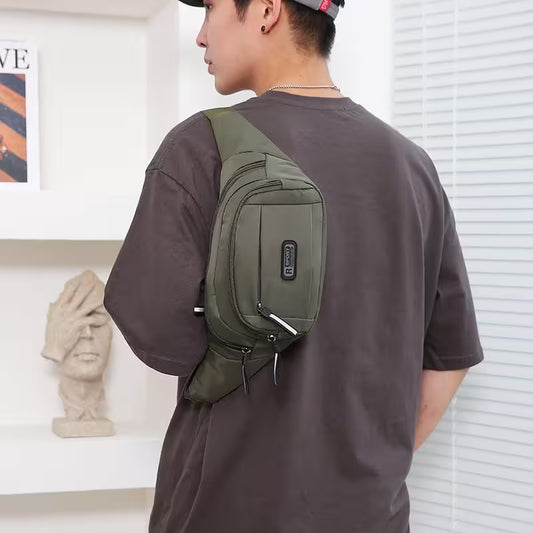 Person wearing a green sling bag in an indoor setting