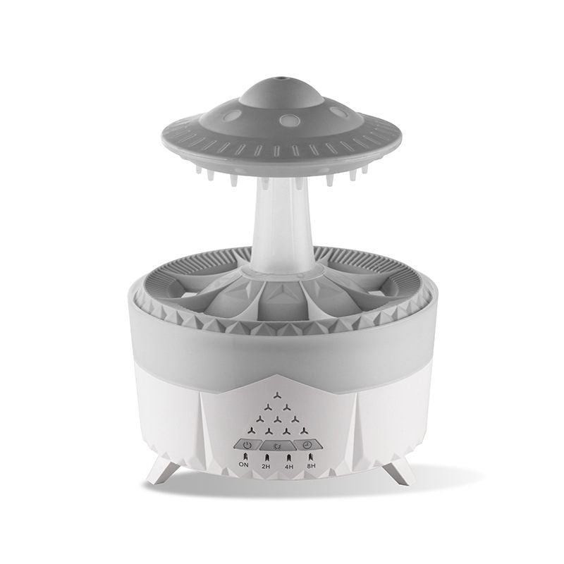 Gray UFO-shaped device on a white background