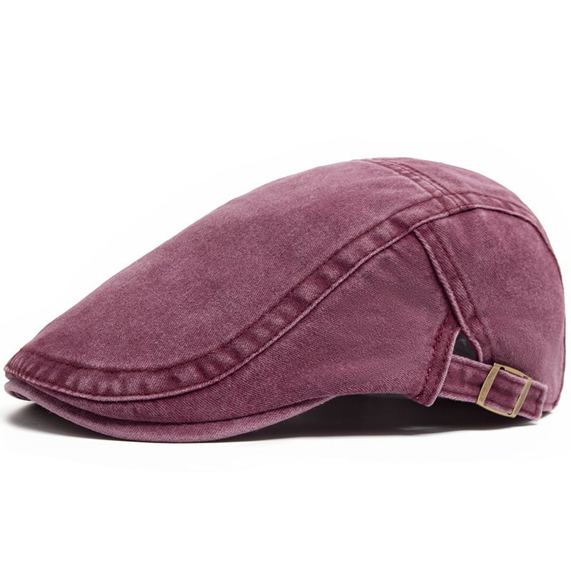 Purple flat cap on a white background