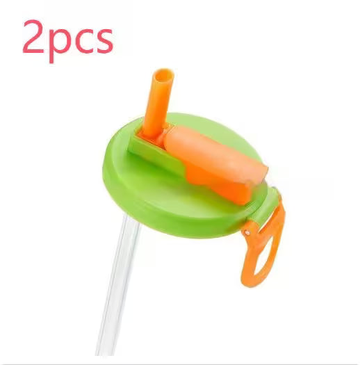 Two green and orange sippy cups with straws on a white background