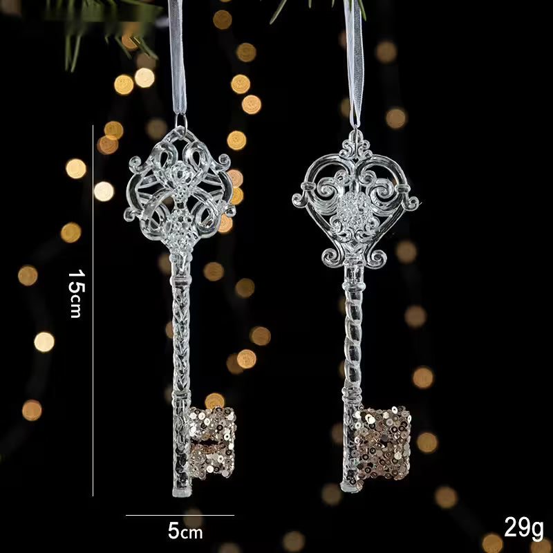 Decorative silver key ornaments with sequins on a dark background with bokeh lights.