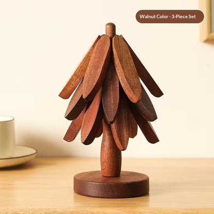 Wooden decorative item resembling a tree on a wooden surface with a neutral background