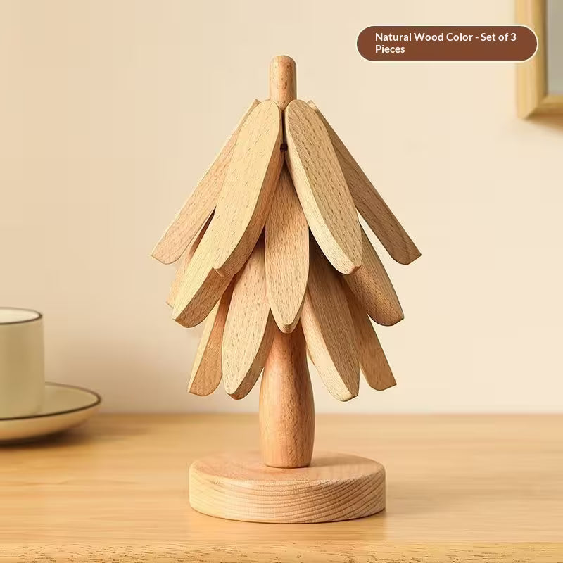Wooden decorative item resembling a tree on a wooden surface with a neutral background
