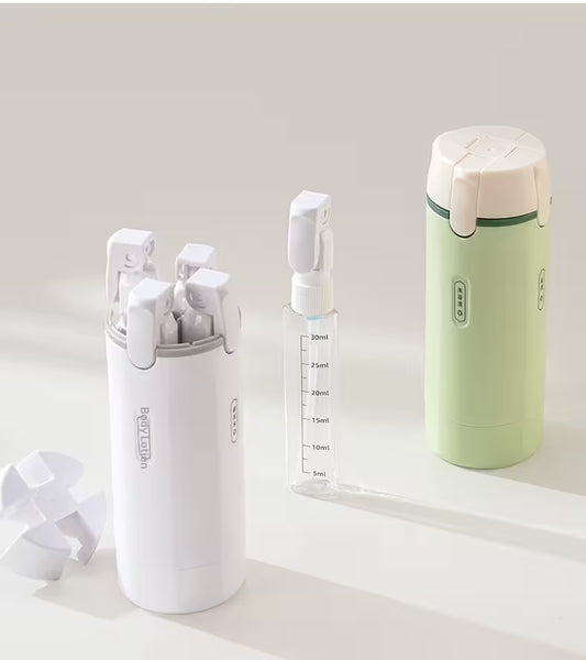 Set of white and green containers on a light background