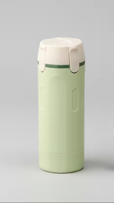 Green and beige thermos bottle on a gray background