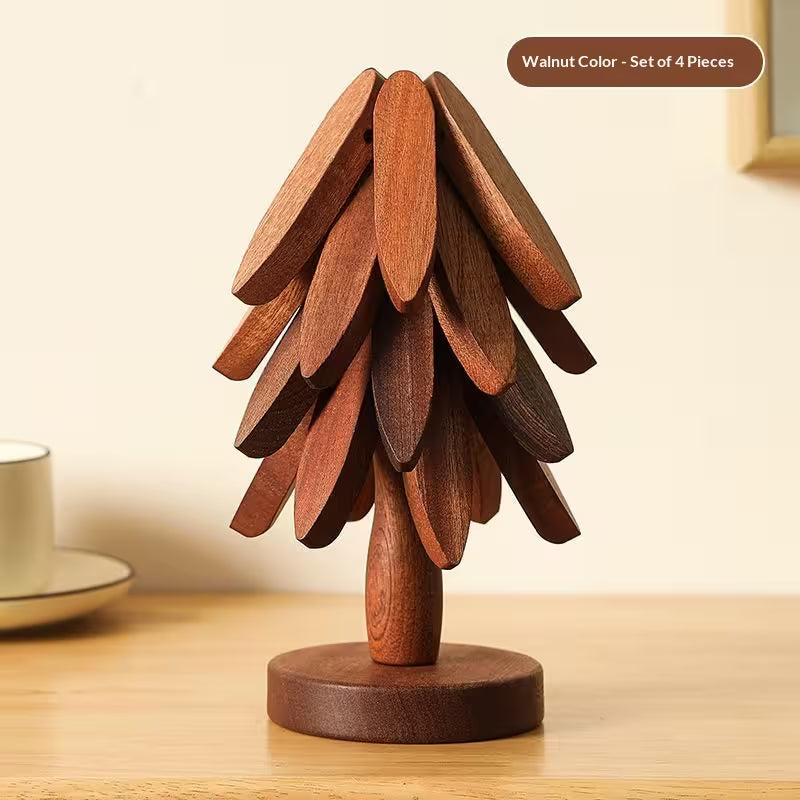 Wooden decorative item resembling a tree on a wooden surface with a neutral background