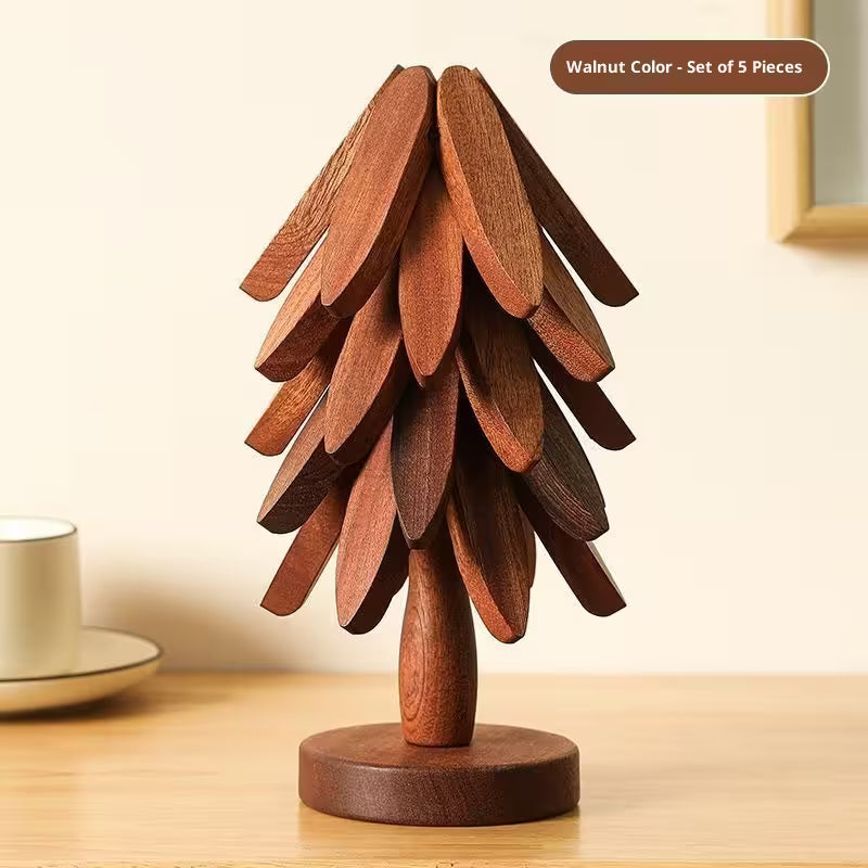 Wooden decorative item resembling a tree on a wooden surface with a neutral background