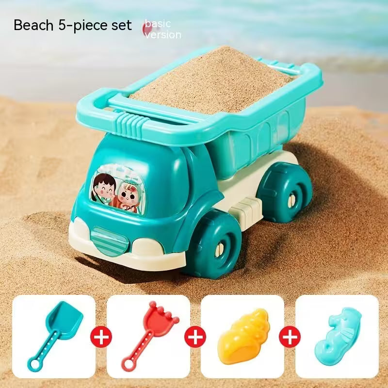 Toy sand truck with sand on top, surrounded by smaller beach toys on a sandy background.