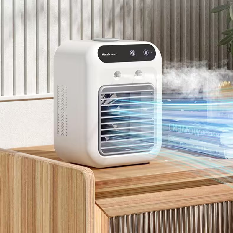 White portable air cooler on a wooden surface with steam rising